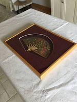 Front view of framed floral fan