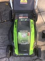 Top view of mower showing model, deck and handle area