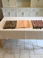 Three folded scarves showing colors and patterns