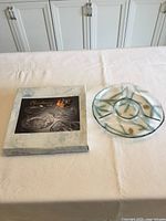 Box and plate on table