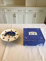Cake stand and box on table