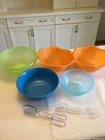 all five bowls and two utensils displayed on table