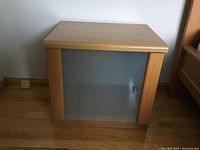 Front view of beech night table showing frosted glass door