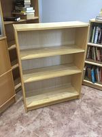 Front view showing birch finish and three shelves