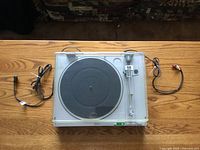 Top view of Sony PS-LX4 turntable with cables and dust cover open