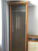 Wardrobe closed showing frosted glass doors and beech frame