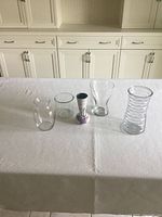 Group shot of five vases on table