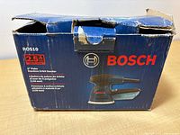 Front of box showing Bosch ROS10 sander details