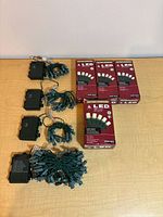 Four battery packs, bundled light strings, four retail boxes