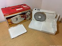 Overall view of Krups food slicer with tray and box