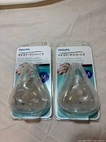 Front view of two sealed Philips Respironics Amara medium cushions in blister packaging