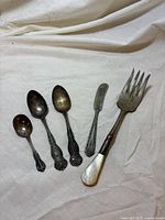 All five pieces laid flat for full view of styles and condition