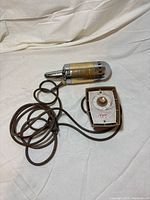 Front view of massager, control box, and cord