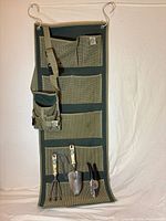 Full view of hanging organizer with tools and pouch attached