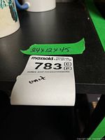 Green tape showing handwritten dimensions 24x12x45 on cabinet top edge