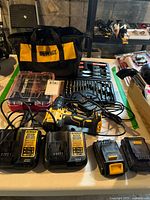 Overall lot with drill, chargers, batteries, bit sets, bag