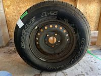 Full view of Goodyear Eagle LS tire on rim