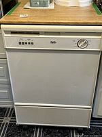 Front view of Inglis portable dishwasher with countertop and wheels