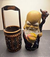Front view of Shou Xing figurine and carved bamboo pail