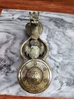 Top view of hardstone ink stone showing dragon head, bat motif and circular well