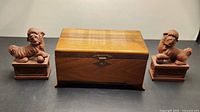 Wooden desktop box flanked by two ceramic Foo dog pen holders