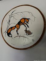 Front view of painted drum showing full artwork