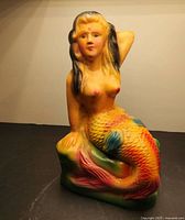 Front view of ceramic mermaid coin bank