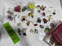 Wide shot of all ornaments, beads, and storage box laid out on quilt