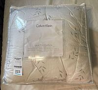 Packaged Calvin Klein Laurel Print comforter front view with label visible