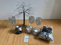 Group shot showing all candle holders, wire tree, oil warmer and bag of tealights