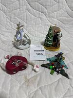 Group shot of four ornaments showing overall condition