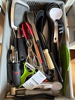 drawer containing assorted kitchen utensils