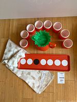 full set laid out: pitcher, 8 cups, tray, folded tablecloth