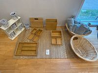 Entire lot showing cubby shelf with bins, bamboo items, wicker baskets, towels, jute rug