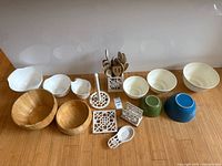 All items grouped together showing bowls, cast iron pieces, utensil holder with utensils
