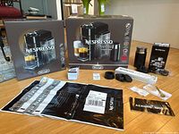 Overall lot with boxes, frother, accessories and packaging