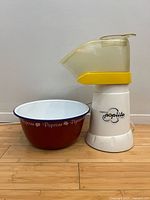 Popcorn maker and bowl side by side