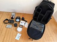 Group view of backpack open with all accessories arranged