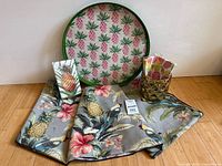 Group shot of all items: tray, tablecloth, napkins, planter