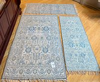 All three rugs laid out showing size and color