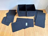 All eight bins displayed, two assembled, six folded with inserts