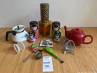 Full lot showing teapots, canisters, tin and assorted accessories
