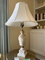Full view of lamp with shade on side table