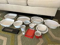 All pieces laid out on rug under sofa