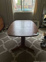 Top view of teak dining table showing surface and rounded edges