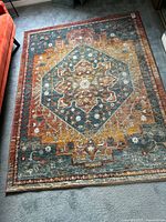 Full view of multicolor oriental floral rug on floor