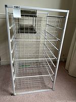 Front view of metal wire drawer rack with five baskets