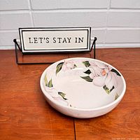 Overall lot showing sign on stand and floral bowl