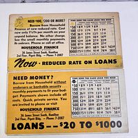 Both posters showing yellow text side with loan rate tables