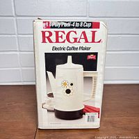 Front of boxed Regal Poly Perk percolator shows product image, capacity and branding